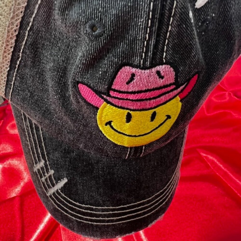 Cowboy Hat Happy Face Trucker Hat from the brand Katydid. Yellow smiley face